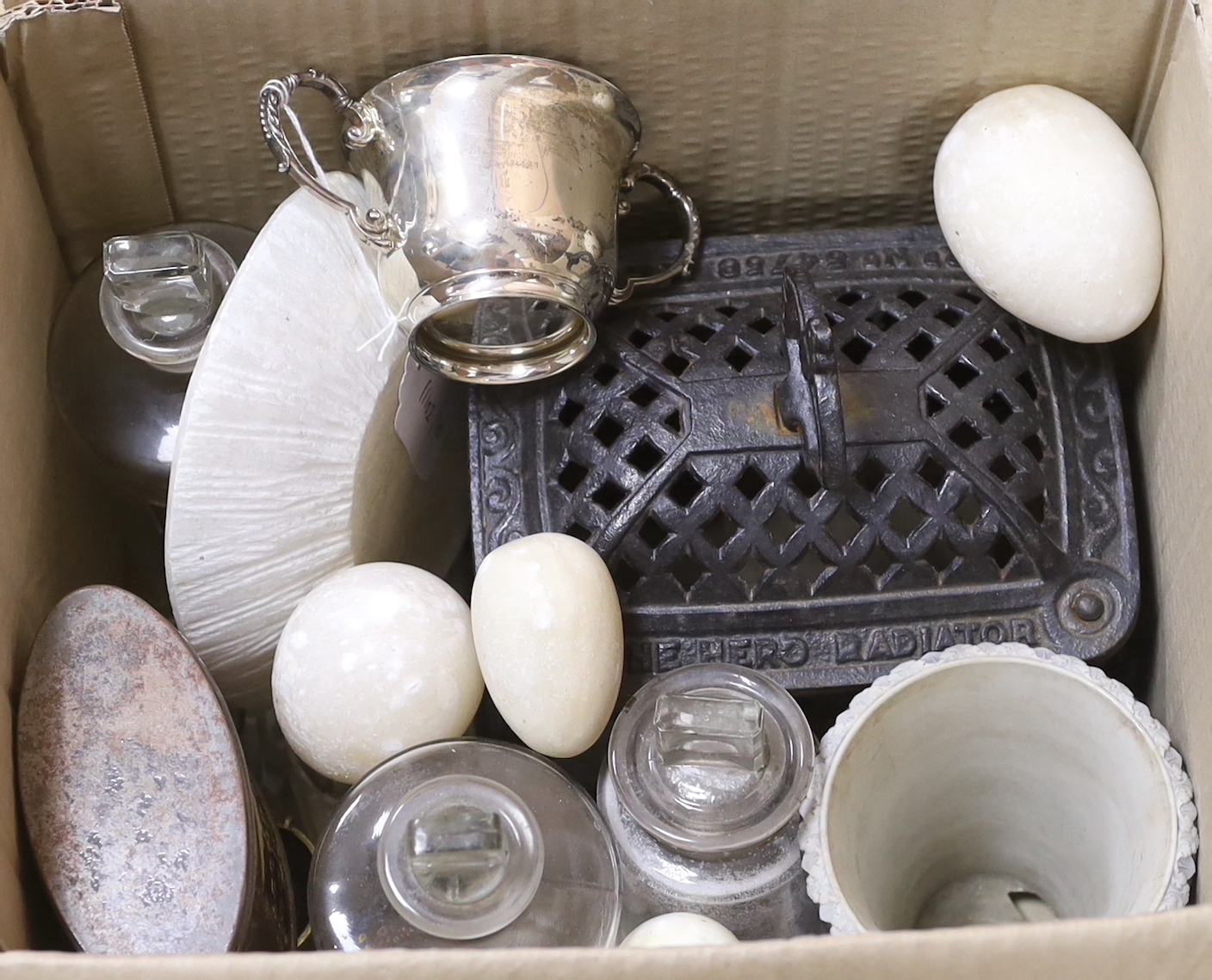 Sundry items including Victorian cast iron 'Hero Radiator', a silver twin handled cup with gilt interior, three apothecary jars